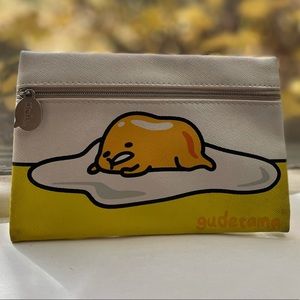 NWOT never used Gudetama makeup pouch 🧡💛
